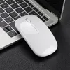 A white wireless mouse is placed on a black textured surface next to a laptop keyboard. Produktbild-Vorschau