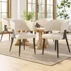 A dining room setting with chairs around a table. Náhľad obrázku produktu