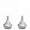 Two identical table lamps with white shades and silver bases are shown against a white background. Náhľad obrázku produktu