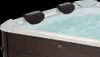 Close-up view of the top edge of a hot tub filled with bubbling water. Náhľad obrázku produktu