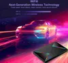 A futuristic marketing image featuring a sports car and a black electronic device with colorful LED accents, set against a vibrant, abstract background. Podgląd zdjęcia produktu