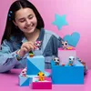 A young girl is playing with Littlest Pet Shop toys, which are displayed on colorful blocks. Podgląd zdjęcia produktu