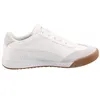 A side view of a white sneaker with a gum sole. Produktbild-Vorschau