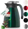 A green thermos jug is shown with various color options displayed on the right side. Coffee beans and leaves are scattered around the base of the jug. Podgląd zdjęcia produktu