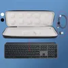 A keyboard and its accessories are displayed against a blue background. Podgląd zdjęcia produktu
