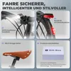 A collage of four images showcasing different features of a bicycle, including the front light, rear light, saddle, and a gift box with accessories. Produktbild-Vorschau