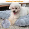 A white poodle-like dog is lying on a gray plush dog bed. A close-up inset shows the texture of the fabric. Podgląd zdjęcia produktu