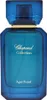 A product shot of a blue perfume bottle with gold accents. Podgląd zdjęcia produktu