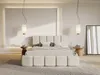 A modern bedroom with a bed, nightstands, and a mirror. Produktbild-Vorschau