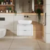 A modern bathroom vanity with a vessel sink and a wall-mounted toilet. Produktbild-Vorschau