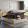 A bedroom scene with a bed that has its storage compartment open, revealing items inside. The bed has a tufted headboard with LED lighting. Produktbild-Vorschau