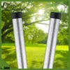 Two metal posts with black caps in front of a blurred green background of trees and grass. Produktbild-Vorschau