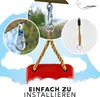 Collage showing different parts of a swing set installation, including carabiners, rope, and a red swing seat, against a cloudy sky background. Produktbild-Vorschau