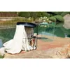 Two wire basket tables are placed on a stone patio next to a body of water. Produktbild-Vorschau
