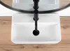 A top-down view of a white rectangular sink with a black faucet, set against a wooden surface and a black-framed mirror. Podgląd zdjęcia produktu