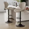 Two beige bar stools are shown in a modern kitchen setting. Produktbild-Vorschau