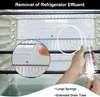 A close-up view inside a refrigerator, showing a hand using a syringe with an extended drain tube to clean a drain hole. Produktbild-Vorschau