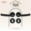 A marketing image showcasing a black door handle set with keyhole escutcheons, presented against a textured light beige background with a stylized house outline and brand logo. Produktbild-Vorschau