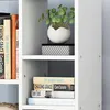 A close-up view of a white bookshelf with several books and a potted plant. Náhled obrázku produktu