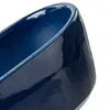 A close-up view of the rim and side of a dark blue ceramic pot. Náhled obrázku produktu