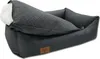 A dog bed with raised sides and a quilted top. Anteprima dell’immagine prodotto