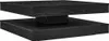 A black, square coffee table with a rotating top.