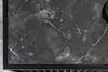 A close-up view of a dark marble tabletop with a black metal frame. Produktbild-Vorschau