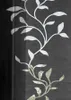A close-up of a decorative fabric panel with a floral vine pattern. Produktbild-Vorschau