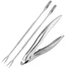 A set of stainless steel seafood tools, including a crab cracker and two seafood forks, arranged on a white background. Podgląd zdjęcia produktu