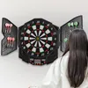 A woman is standing in front of a dartboard, ready to play. Náhľad obrázku produktu