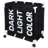 A black laundry basket with three compartments labeled 'DARK', 'LIGHT', and 'COLOR', and white frame with wheels. Anteprima dell’immagine prodotto