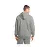 A man is shown from the back wearing a grey hoodie and sweatpants. Produktbild-Vorschau
