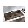 A modern kitchen sink with a faucet, drain, and a cutting board with a knife. Náhľad obrázku produktu
