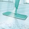 A turquoise spray mop is shown spraying water onto a tiled floor. Anteprima dell’immagine prodotto