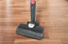 A vacuum cleaner head on a wooden floor. Produktbild-Vorschau