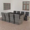 An outdoor dining set with chairs and a table, placed in a room with windows. Produktbild-Vorschau