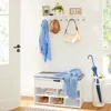 A hallway entryway with a shoe storage bench and a wall-mounted shelf for coats and accessories. Produktbild-Vorschau
