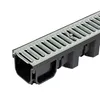 A close-up, angled view of a drainage channel with a metal grate. Anteprima dell’immagine prodotto