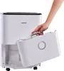 A hand is shown removing the water collection tank from a white dehumidifier. Anteprima dell’immagine prodotto