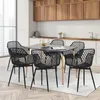 A dining set with black chairs and a black table in a modern kitchen setting. Voir les images du produit
