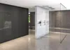 A modern bathroom with a large dark gray cabinet on the left and a glass-enclosed shower area with tiled walls on the right. Voir les images du produit