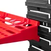 A close-up view of a red tool organizer attached to a black tool board. Náhled obrázku produktu