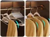 A split image showing a set of hangers in a closet. The left side shows multiple hangers stacked, and the right side shows three sweaters hanging on individual hangers. Voir les images du produit