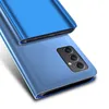 A blue flip case for a Samsung Galaxy A54 5G phone, shown from a diagonal angle, highlighting the camera module. Produktbild-Vorschau