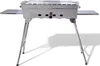 A stainless steel portable grill with foldable legs and side shelves, shown on a white background.