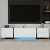 A modern white TV cabinet with LED lighting and a large black television mounted above it. Náhľad obrázku produktu