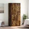 A tall, wooden wardrobe with two doors is shown in a room with a painting on the wall and a plant. Voir les images du produit