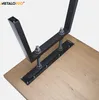 A close-up view of black metal table legs being attached to a wooden tabletop. Podgląd zdjęcia produktu
