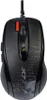 A black gaming mouse with an orange button is shown from a top-down perspective against a white background. The mouse has a textured design with what appears to be text and a skull graphic. Náhled obrázku produktu