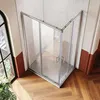 A modern corner shower enclosure with sliding doors in a bathroom setting. Produktbild-Vorschau